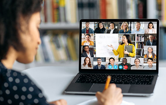 Female employee on laptop doing virtual training