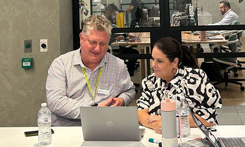 Seath, Recruitment lead, with Gordon at desk