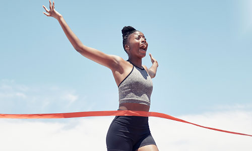 Female sprinter winning race