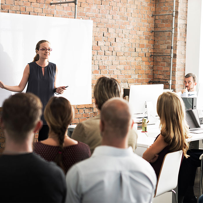 Lady presenting training to leaders