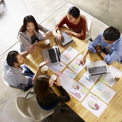 Team sitting around a table in discussion