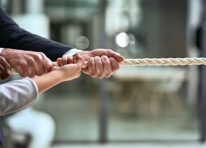 Hands pulling on rope